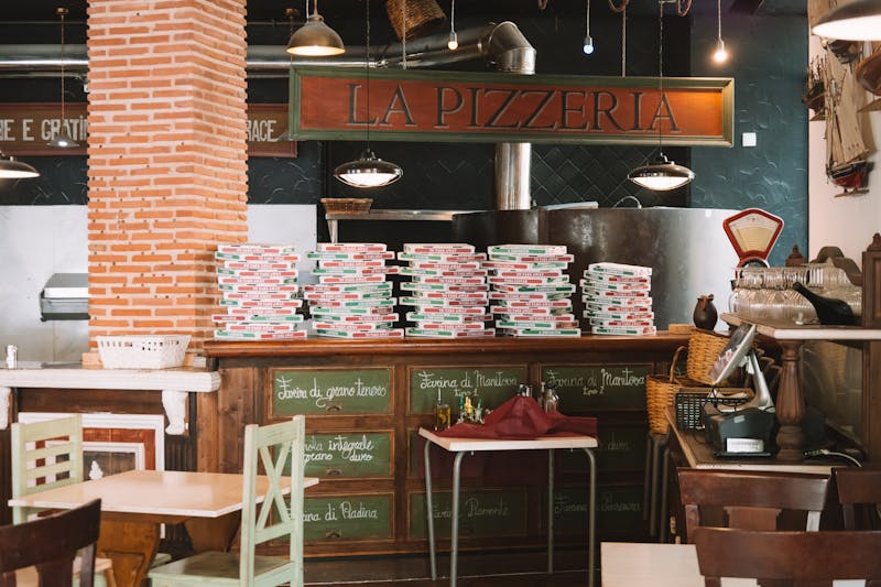 Mod Pizza restaurant interior with warm lighting and cozy seating